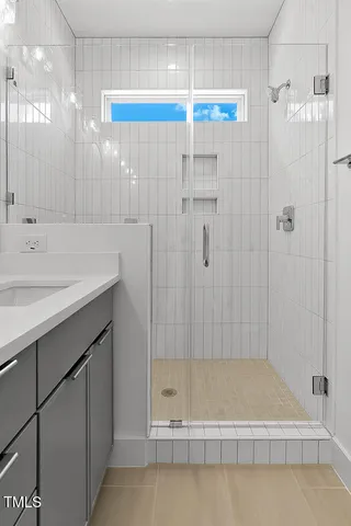 a bathroom with a bathtub and a shower