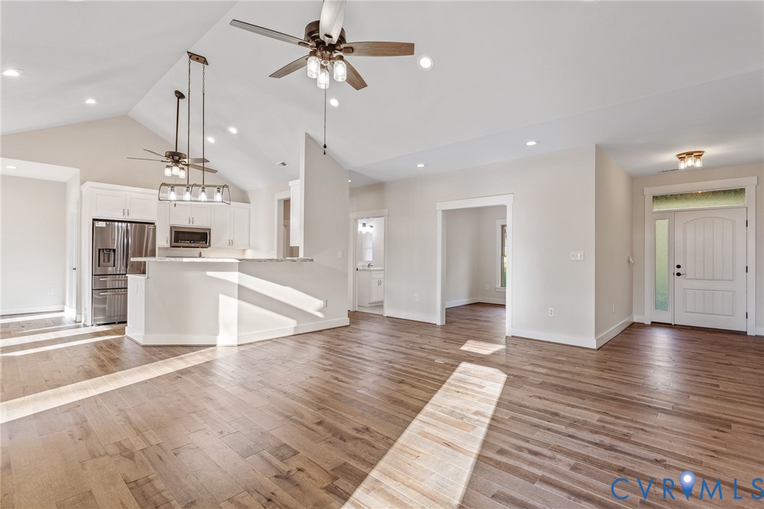 2516 Miry Run Road Sutherland, VA 23885 - Photo 11 of 45 a view of a kitchen with wooden floor and a kitchen space with a sink