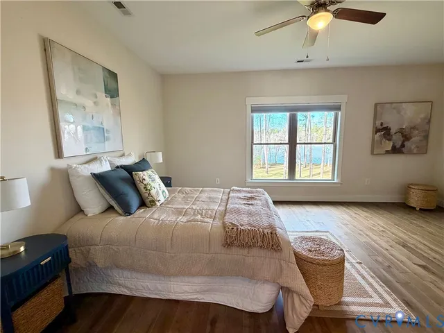 a living room with furniture a fireplace and a chandelier