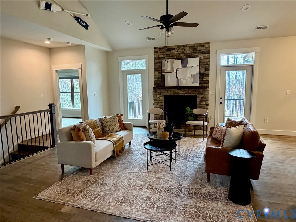 2516 Miry Run Road Sutherland, VA 23885 - Photo 30 of 45 a living room with furniture a fireplace and a chandelier