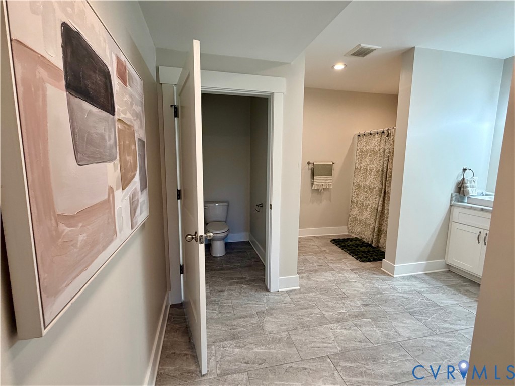 2516 Miry Run Road Sutherland, VA 23885 - Photo 39 of 45 a view of a hallway with a livingroom and a bathroom
