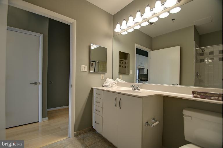 1300 N Street Northwest, Unit 812 Washington, DC 20005 - Photo 15 of 30 a bathroom with a sink and a mirror