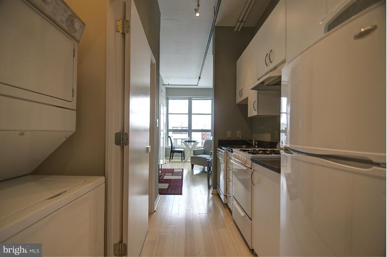 1300 N Street Northwest, Unit 812 Washington, DC 20005 - Photo 22 of 30 a kitchen with a refrigerator stove and a sink