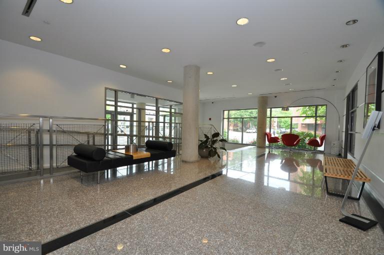 1300 N Street Northwest, Unit 812 Washington, DC 20005 - Photo 26 of 30 a living room with furniture and a large window