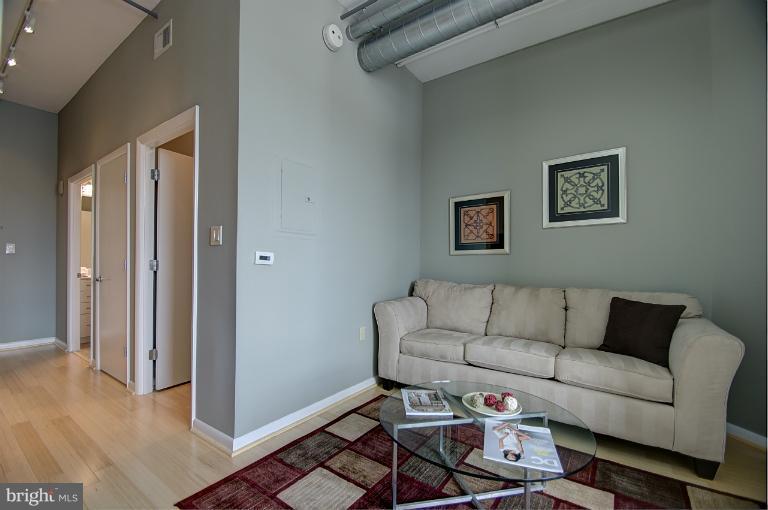 1300 N Street Northwest, Unit 812 Washington, DC 20005 - Photo 29 of 30 a living room with furniture and a window