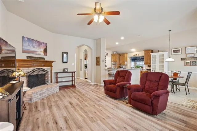 a living room with furniture and a fireplace
