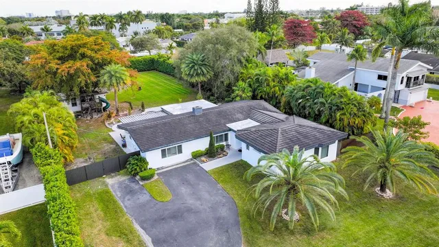 an aerial view of a house with a garden