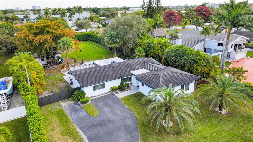 an aerial view of a house with a garden