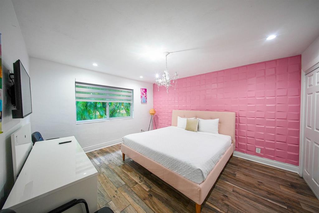 241 Southwest 129th Avenue Miami, FL 33184 - Photo 15 of 27 a bedroom with a bed and a flat screen tv