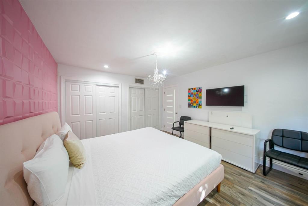 241 Southwest 129th Avenue Miami, FL 33184 - Photo 16 of 27 a spacious bedroom with a bed and a couch