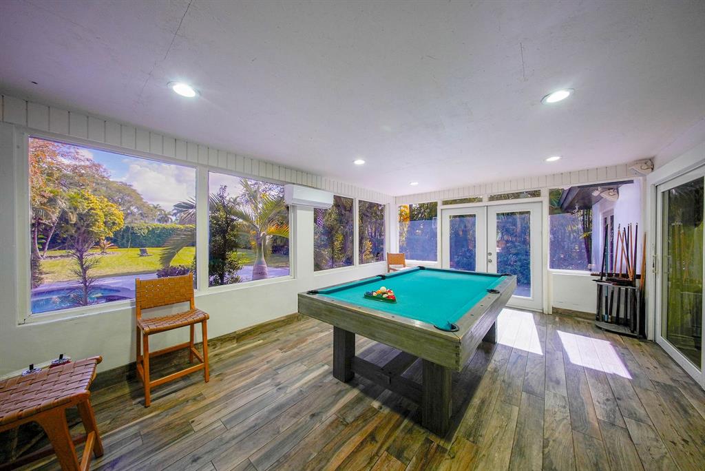 241 Southwest 129th Avenue Miami, FL 33184 - Photo 20 of 27 a room with furniture pool table flat screen tv and a large window