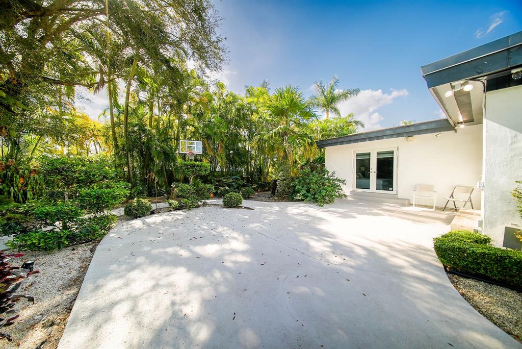 241 Southwest 129th Avenue Miami, FL 33184 - Photo 22 of 27 a view of a house with backyard and a tree