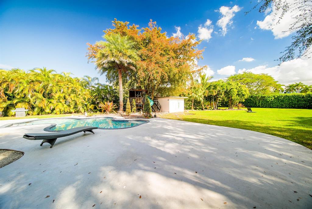 241 Southwest 129th Avenue Miami, FL 33184 - Photo 23 of 27 a view of yard with swimming pool