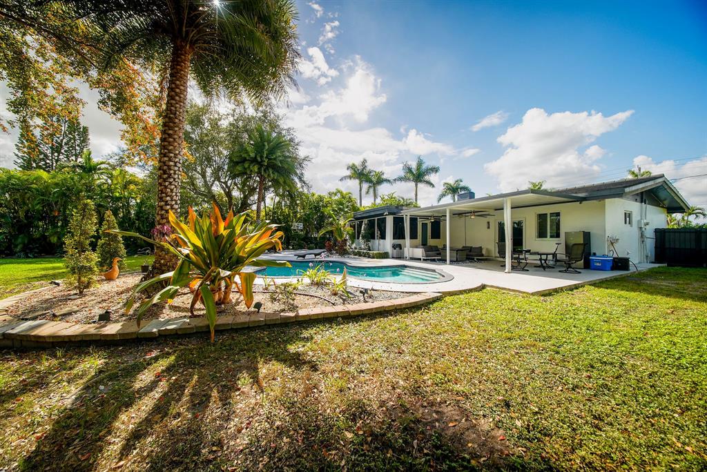 241 Southwest 129th Avenue Miami, FL 33184 - Photo 25 of 27 a view of house with swimming pool and lake view