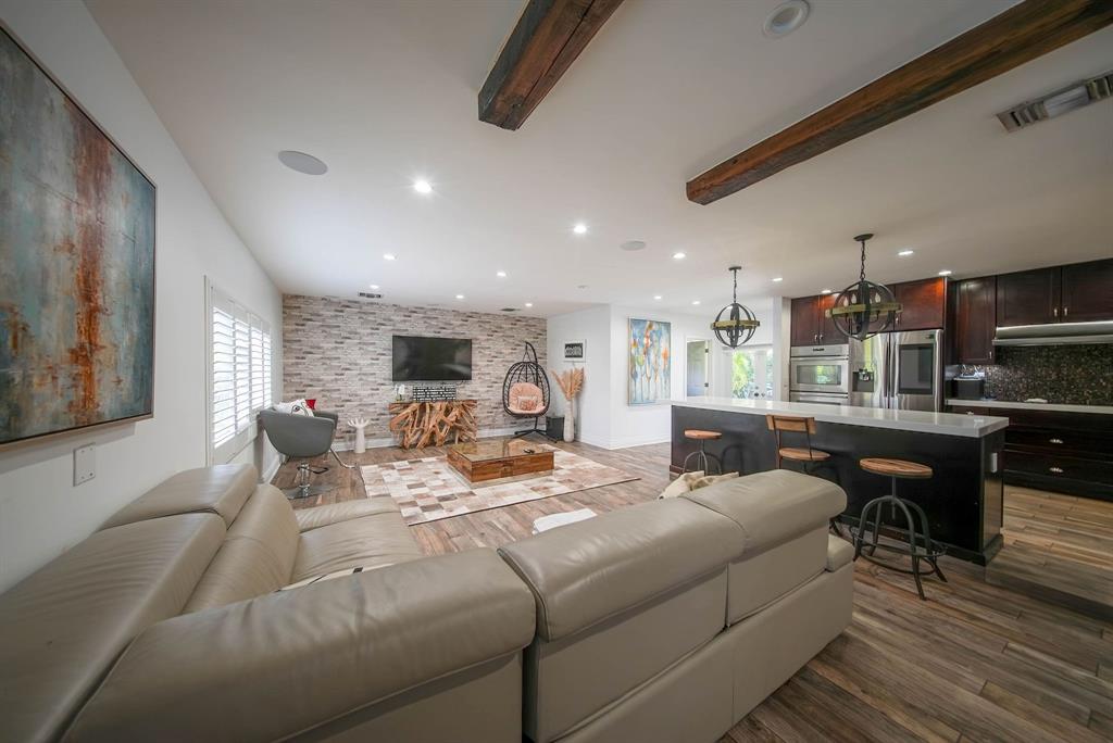 241 Southwest 129th Avenue Miami, FL 33184 - Photo 9 of 27 a living room with furniture kitchen view and a large window