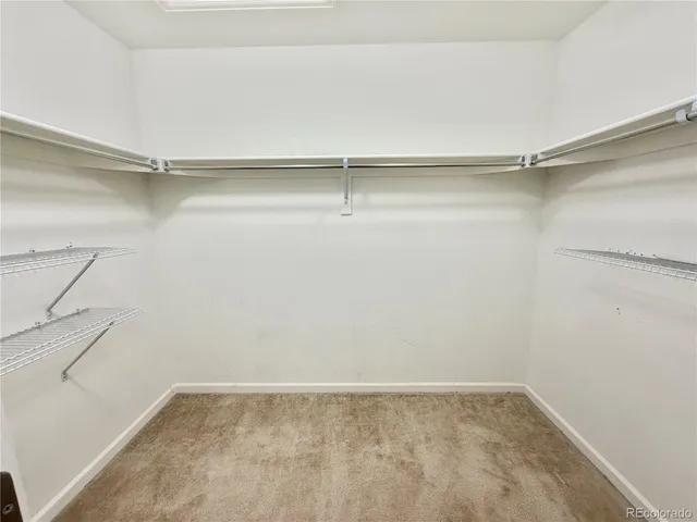 a view of an empty walk in closet