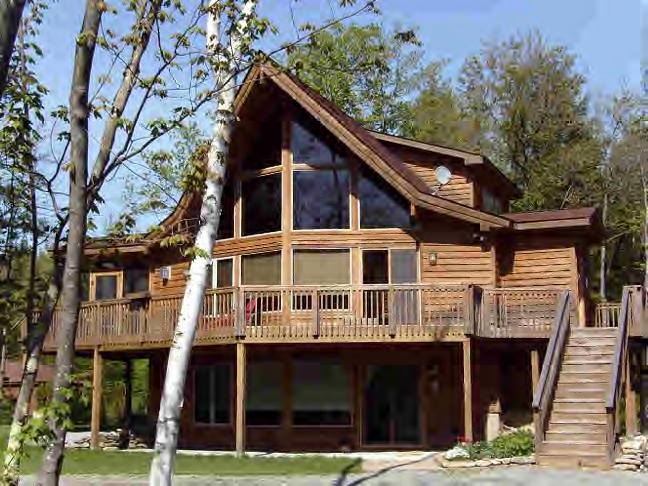 63 Algerie Road Becket, MA 01223 - Photo 1 of 5 a front view of a house with a garden