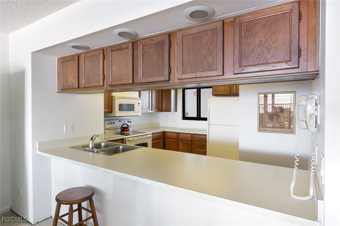 15011 Punta Rassa Road, Unit 505 Fort Myers, FL 33908 - Photo 17 of 40 a bathroom with a sink and a bathtub