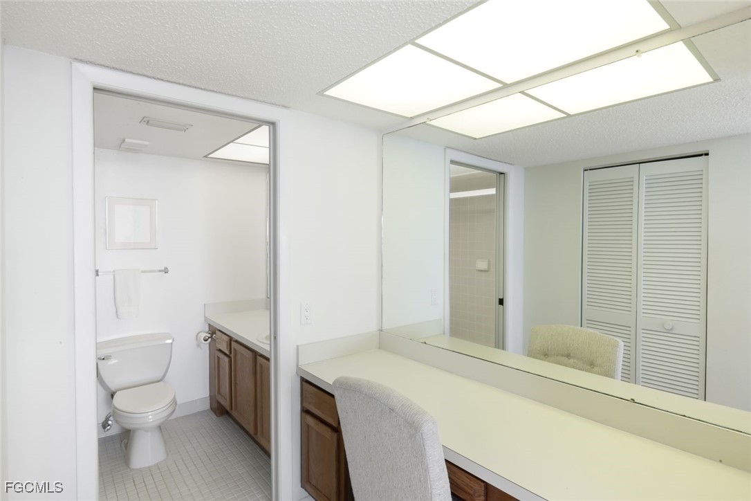 15011 Punta Rassa Road, Unit 505 Fort Myers, FL 33908 - Photo 21 of 40 a bathroom with a sink a toilet and shower