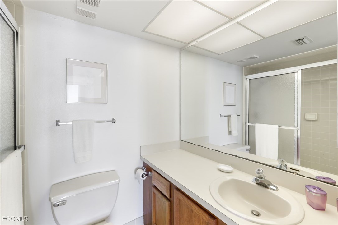 15011 Punta Rassa Road, Unit 505 Fort Myers, FL 33908 - Photo 22 of 40 a bathroom with a sink toilet and shower