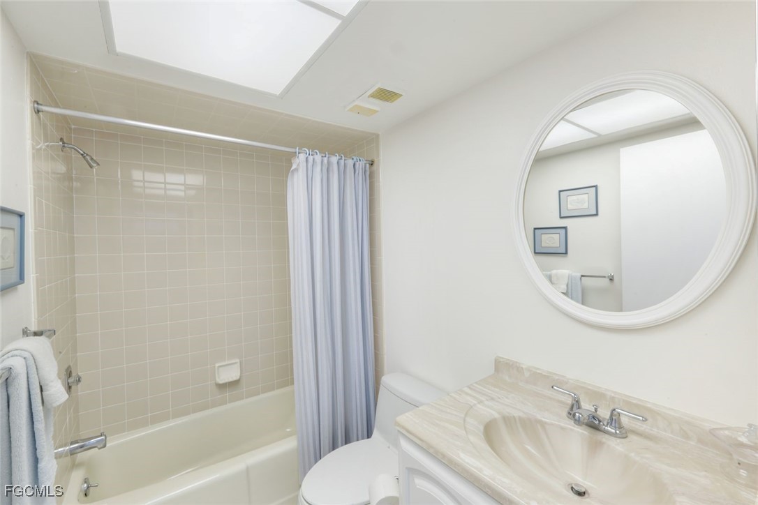 15011 Punta Rassa Road, Unit 505 Fort Myers, FL 33908 - Photo 24 of 40 a bathroom with a sink and a mirror