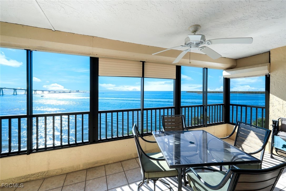 15011 Punta Rassa Road, Unit 505 Fort Myers, FL 33908 - Photo 27 of 40 a view of a balcony dining area with furniture