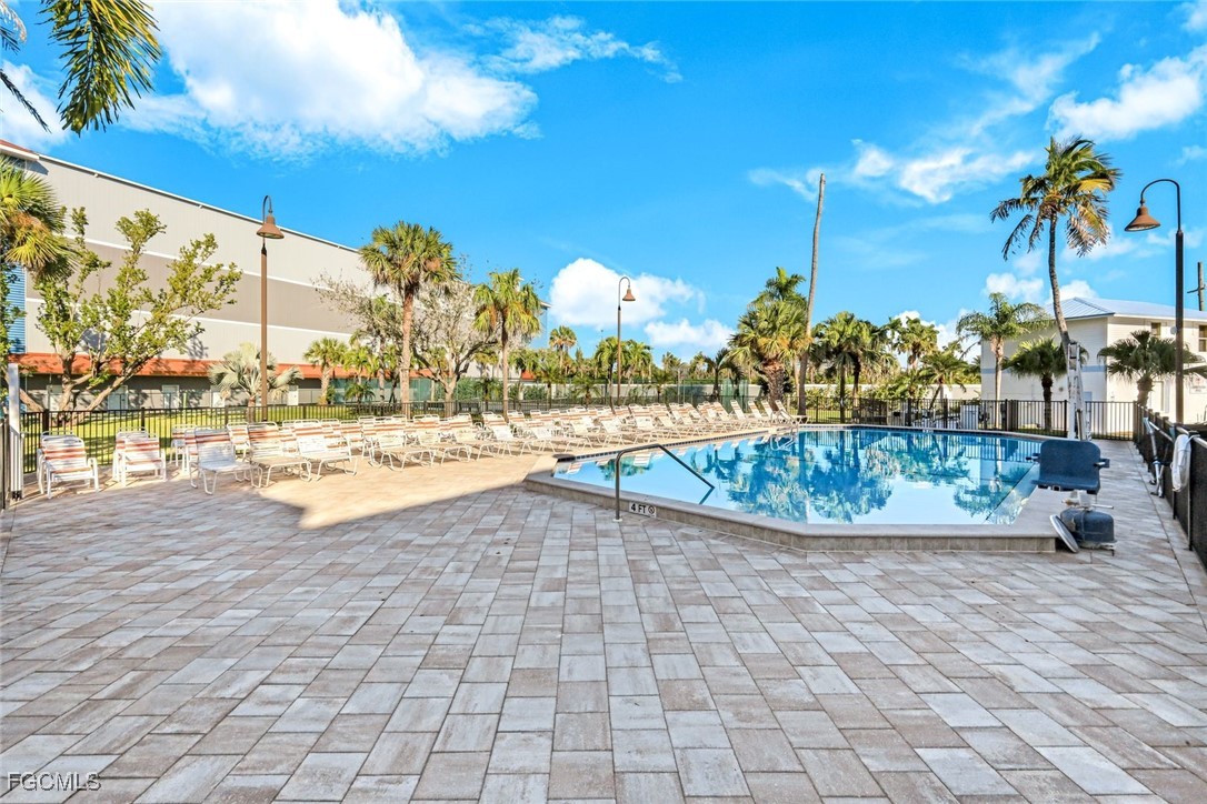 15011 Punta Rassa Road, Unit 505 Fort Myers, FL 33908 - Photo 29 of 40 a view of swimming pool with outdoor seating