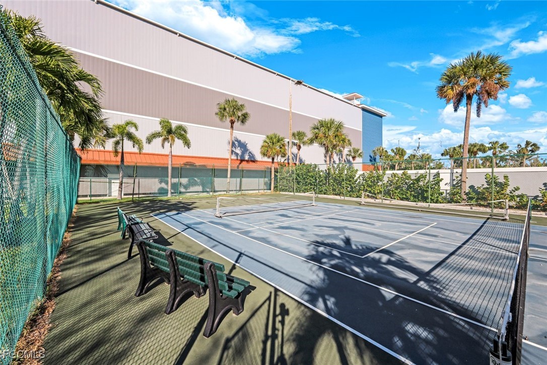 15011 Punta Rassa Road, Unit 505 Fort Myers, FL 33908 - Photo 31 of 40 a view of a patio with table and chairs and potted plants