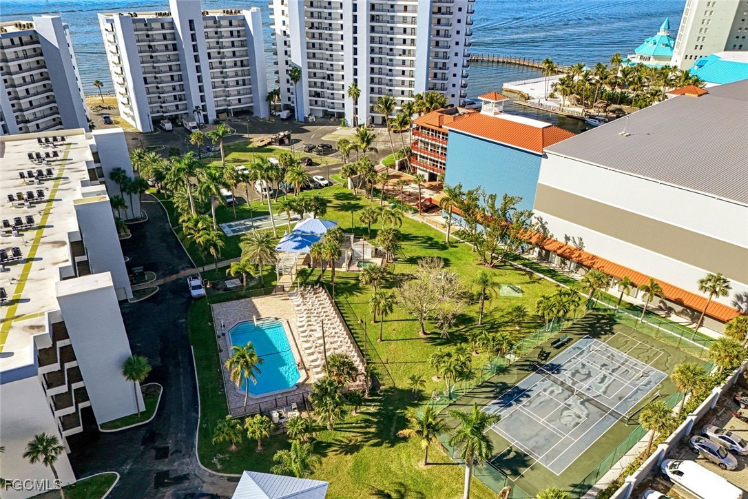 15011 Punta Rassa Road, Unit 505 Fort Myers, FL 33908 - Photo 33 of 40 an aerial view of a residential apartment building with a yard