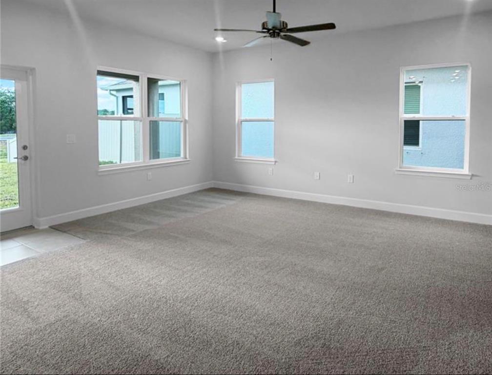 7643 Bent Tree Loop St. Cloud, FL 34773 - Photo 2 of 7 an empty room with windows