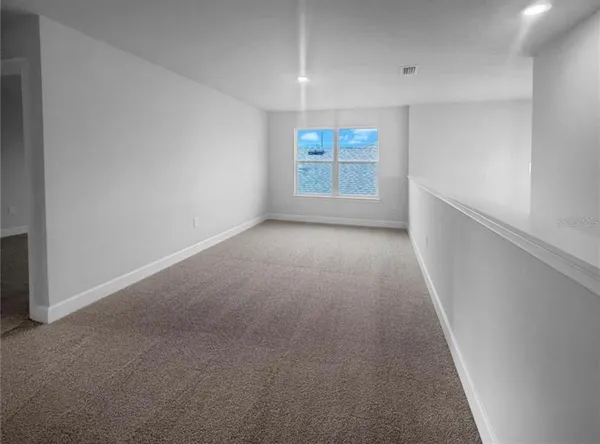 a view of a hallway with a window