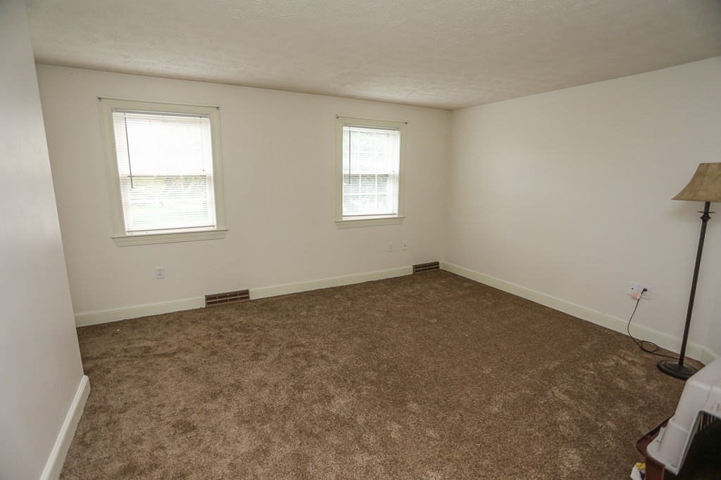 241 Winding Pond Road, Unit 241 Londonderry, NH 03053 - Photo 15 of 30 an empty room with a window