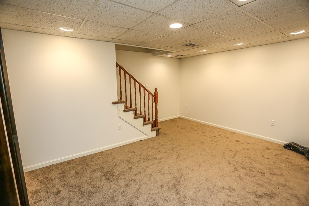 241 Winding Pond Road, Unit 241 Londonderry, NH 03053 - Photo 17 of 30 a view of a hallway with stairs