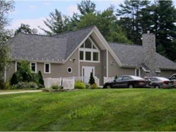 241 Winding Pond Road, Unit 241 Londonderry, NH 03053 - Photo 26 of 30 a front view of house with yard and green space