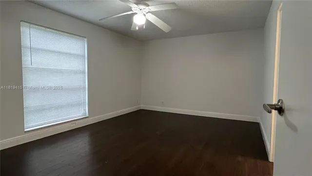 an empty room with a empty space and a window