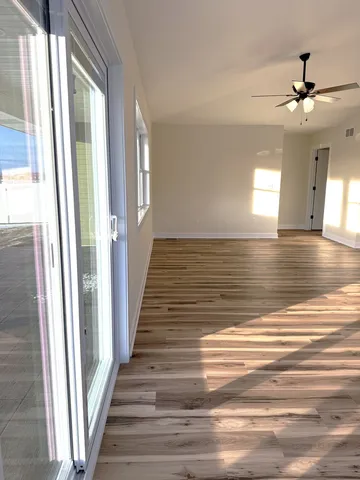 a view of empty room with windows