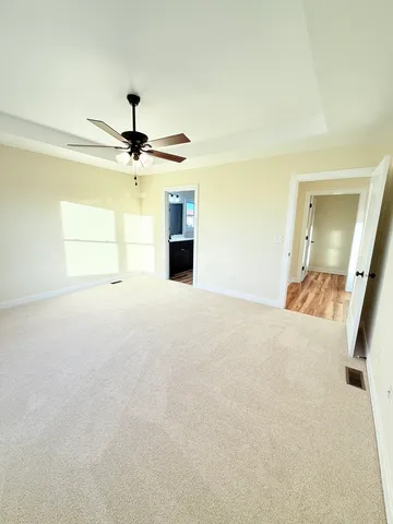 a bathroom with a sink a toilet a mirror and shower