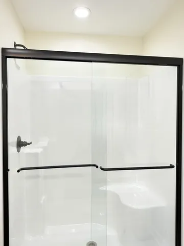 a bedroom with a bed and cabinets