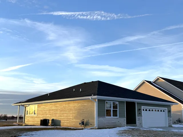 a view of a room with wooden floor and staircase