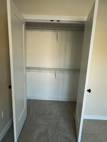 a view of a room with wooden walls