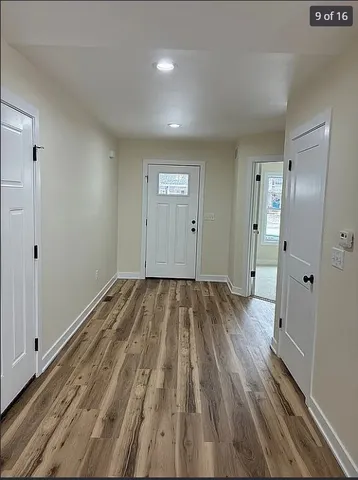 a large kitchen with kitchen island a sink stainless steel appliances and cabinets