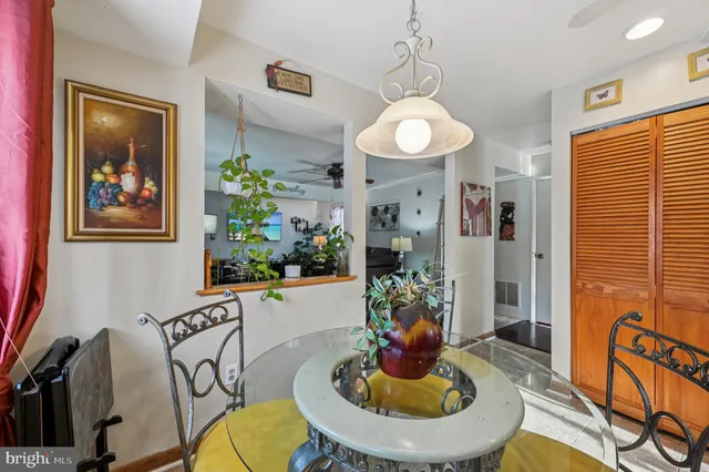 a kitchen with stainless steel appliances a stove a sink cabinets and a microwave