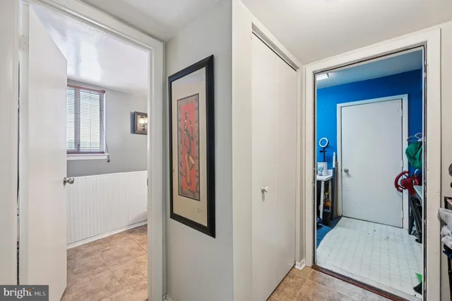 a bed room with a bed and a chandelier