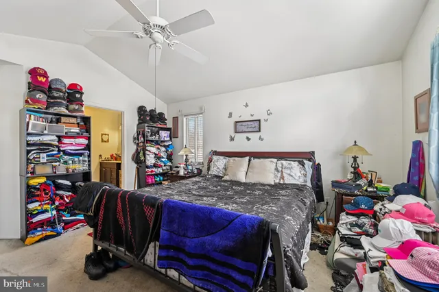 a bathroom with a toilet a sink and a mirror