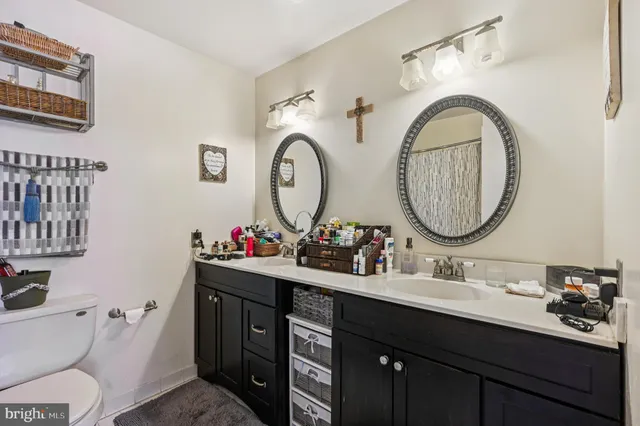 a bedroom with furniture and a large window