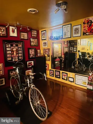 a front view of multi story commercial building with retail shops