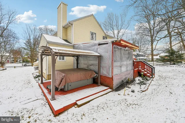 a view of street with a white house