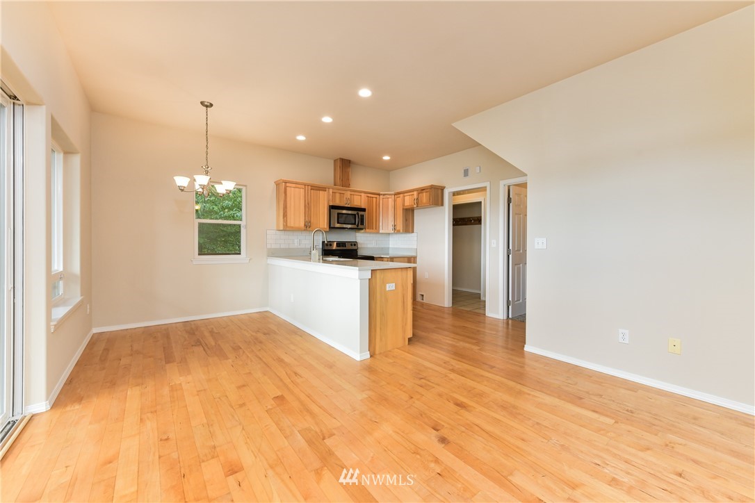 18184 Capet Zalsiluce Road La Conner, WA 98257 - Photo 11 of 25 a kitchen with kitchen island a sink stainless steel appliances and cabinets