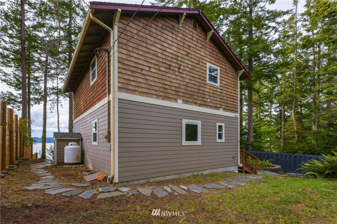 18184 Capet Zalsiluce Road La Conner, WA 98257 - Photo 25 of 25 a view of a house with a yard