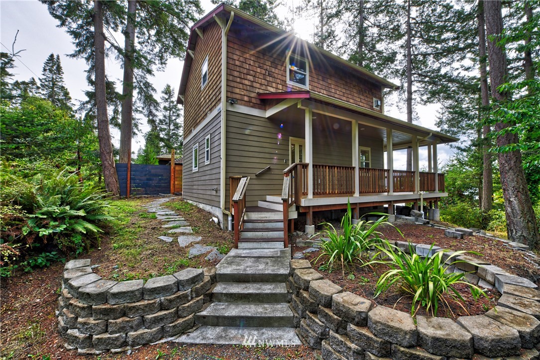 18184 Capet Zalsiluce Road La Conner, WA 98257 - Photo 5 of 25 a front view of a house with garden